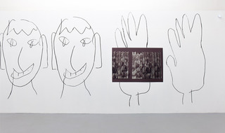 Proposal for cloud (Другу, который не спас мне жизнь), 2017. UV print on aluminium. Decades (three faces, two hands), 2017. Charcoal wall drawing.  Installation view at Andrey Bogush and Bogdan Ablozhnyy: Decades, Osnova gallery, Moscow, Russia, 2018