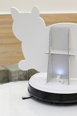 detail: Proposal for hoover, cat cut out and distorted face (The living web of care is not one where every giving involves taking, nor every taking will involve giving)